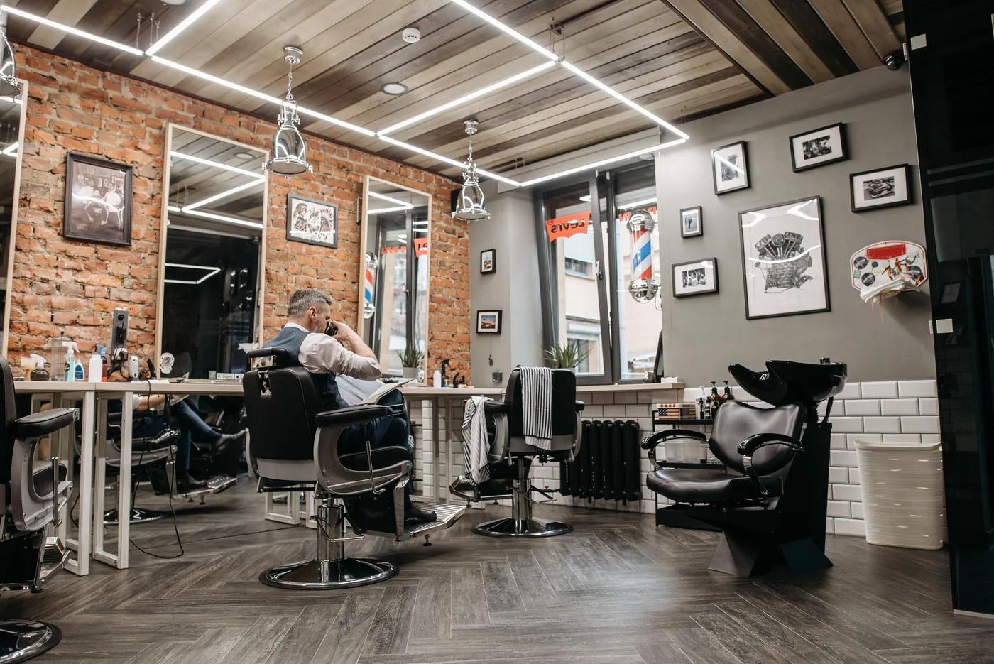 Modern barber shop interior with grooming chairs and mirrors